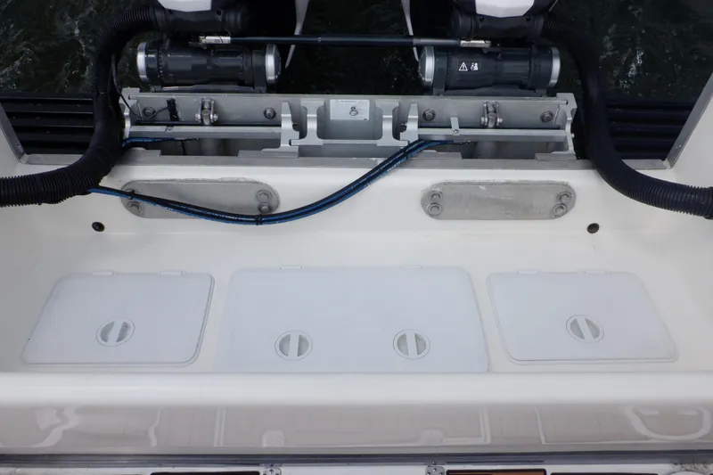 Slide: The Image of 1995 Ocean Master 31 Center Console boat engine compartment with access hatches and wiring. - 29