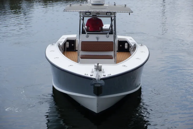 Slide: The Image of 1995 Ocean Master 31 Center Console boat on calm water, front view. - 3