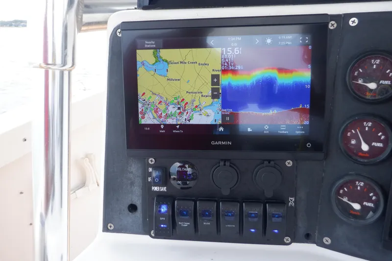Slide: The Image of Garmin navigation system on 1995 Ocean Master 31 Center Console boat dashboard. - 37