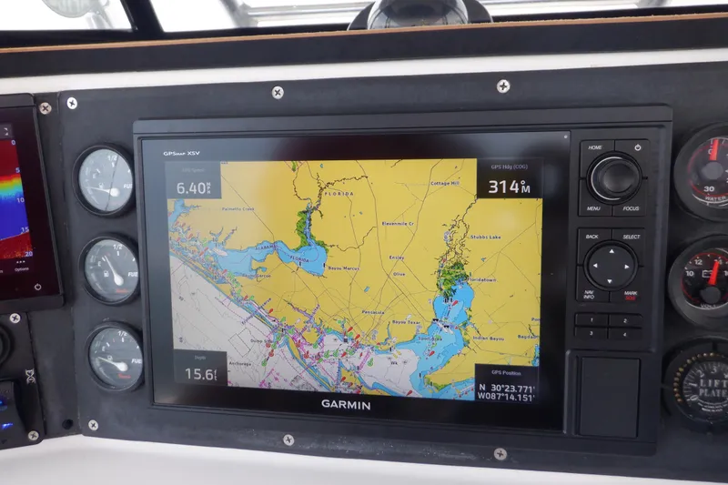 Slide: The Image of Garmin GPS display on 1995 Ocean Master 31 Center Console boat dashboard. - 38