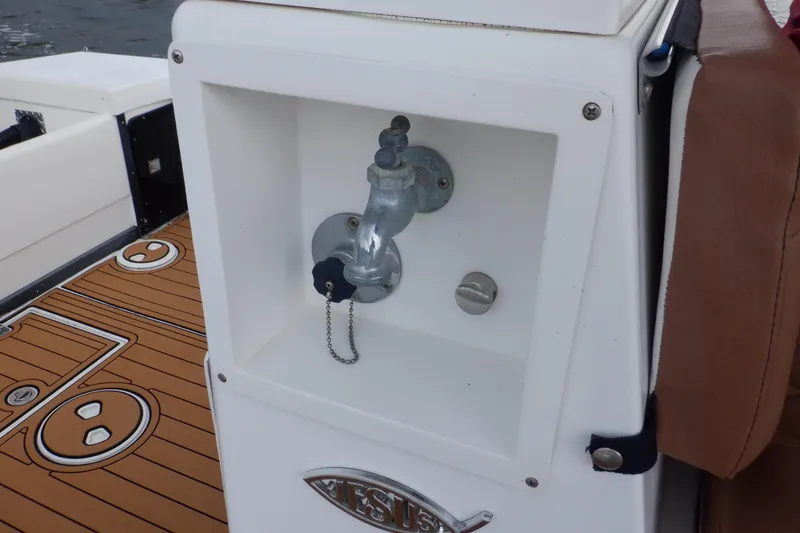 Slide: The Image of Water faucet on 1995 Ocean Master 31 Center Console boat with teak-style deck. - 40