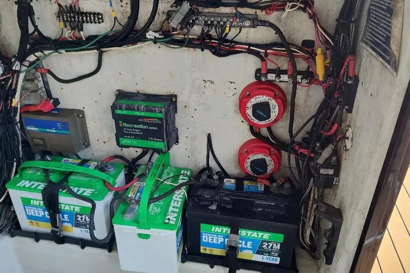 Slide: The Image of Electrical system of a 1995 Ocean Master 31 Center Console with batteries and wiring. - 47