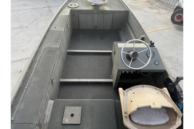 Slide: The Image of 2012 Gator Trax 17X54 boat interior with steering wheel and seating. - 10