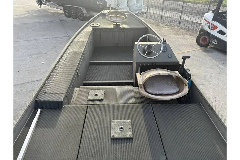 Slide: The Image of 2012 Gator Trax 17X54 boat interior with steering wheel and seating. - 11