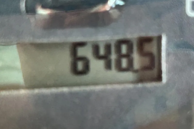 Slide: The Image of Close-up of a digital display showing "6485" on a 2002 Sea Ray 290 Bowrider. - 5