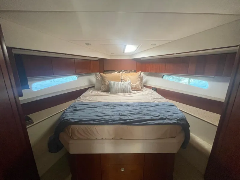 Slide: The Image of Luxurious bedroom interior of 2012 Cruisers Yachts 48 Cantius with cozy bedding. - 14
