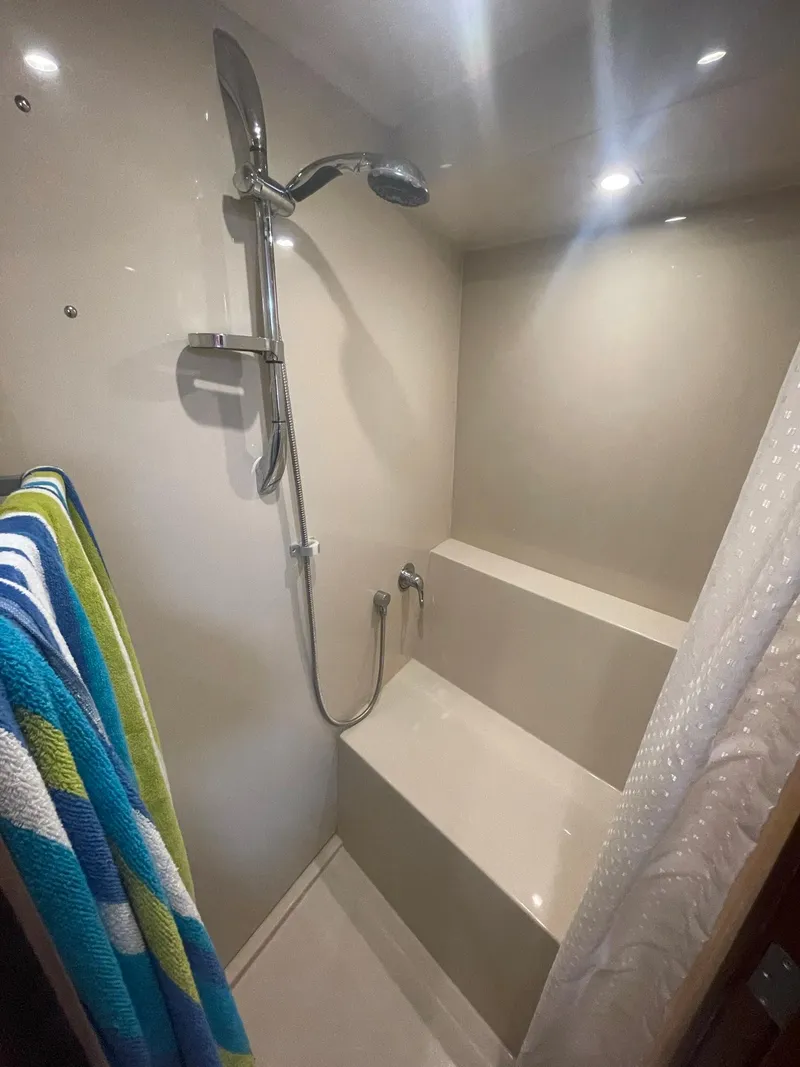 Slide: The Image of Shower area in 2012 Cruisers Yachts 48 Cantius with modern fixtures and colorful towels. - 17