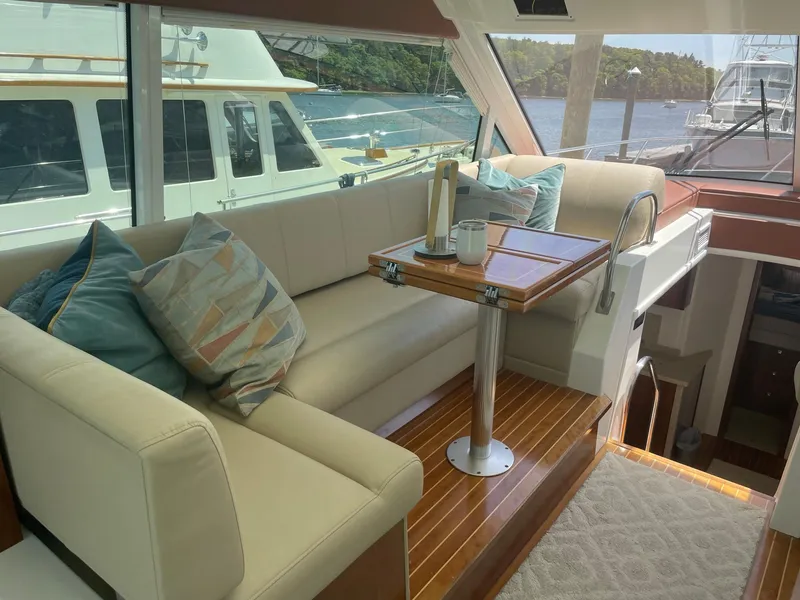 Slide: The Image of Luxurious interior of 2012 Cruisers Yachts 48 Cantius with elegant seating and table. - 2