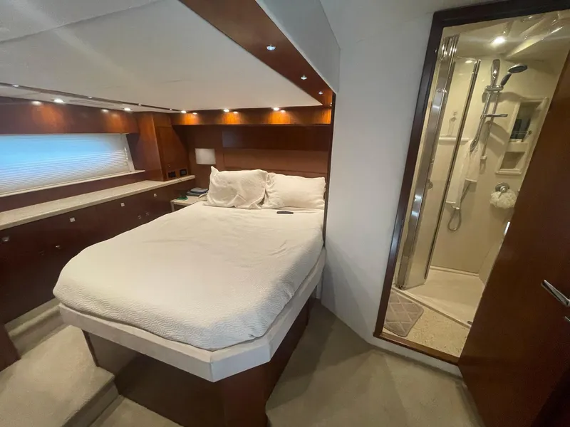 Slide: The Image of Luxurious bedroom and ensuite bathroom in 2012 Cruisers Yachts 48 Cantius. - 21