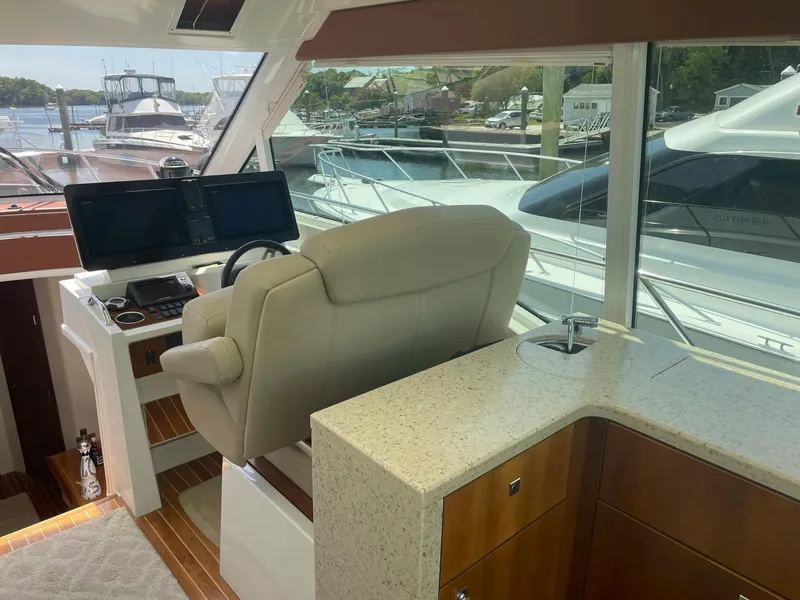 Slide: The Image of Interior helm of 2012 Cruisers Yachts 48 Cantius with modern controls and seating. - 3