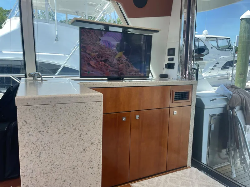 Slide: The Image of Luxurious interior of 2012 Cruisers Yachts 48 Cantius with TV and cabinetry. - 6