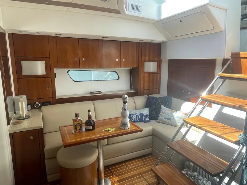Slide: The Image of Luxurious interior of 2012 Cruisers Yachts 48 Cantius with cozy seating and wooden accents. - 11