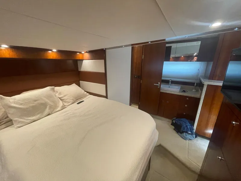 Slide: The Image of Luxurious bedroom interior of 2012 Cruisers Yachts 48 Cantius with elegant wood finishes. - 22