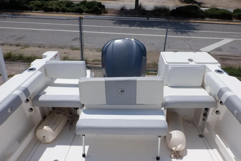 Slide: The Image of 2015 Seaswirl Striper 220 Walkaround boat interior with seating and engine view. - 10