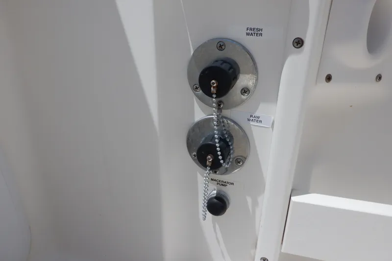 Slide: The Image of Seaswirl Striper 220 Walkaround 2015 boat water connections and macerator pump controls. - 13