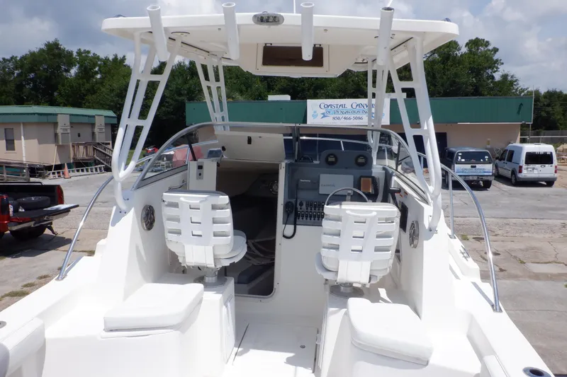Slide: The Image of 2015 Seaswirl Striper 220 Walkaround boat interior with seating and control panel. - 16