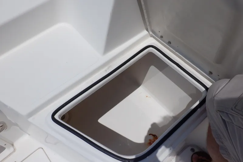 Slide: The Image of Open storage compartment on 2015 Seaswirl Striper 220 Walkaround boat. - 17