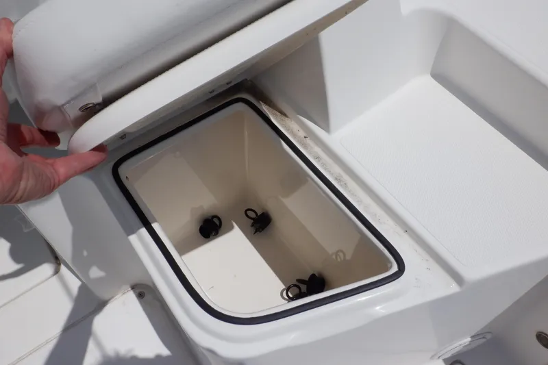 Slide: The Image of 2015 Seaswirl Striper 220 Walkaround boat storage compartment open. - 18