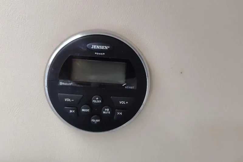 Slide: The Image of Jensen stereo system on 2015 Seaswirl Striper 220 Walkaround boat dashboard. - 23