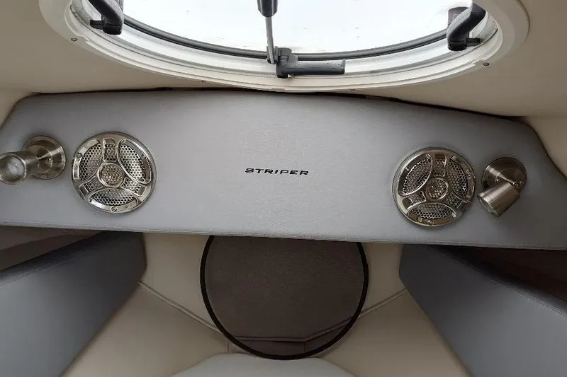 Slide: The Image of 2015 Seaswirl Striper 220 Walkaround cabin interior with speakers and porthole. - 27