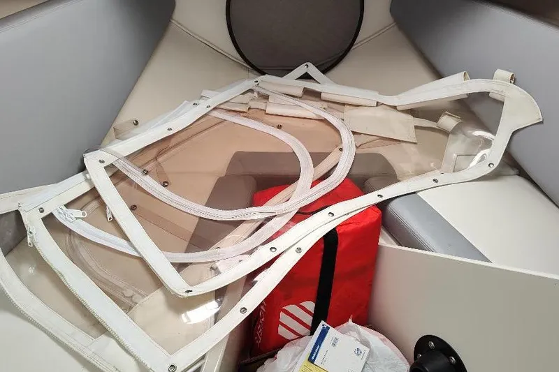 Slide: The Image of 2015 Seaswirl Striper 220 Walkaround cabin with clear panels and red safety bag. - 29