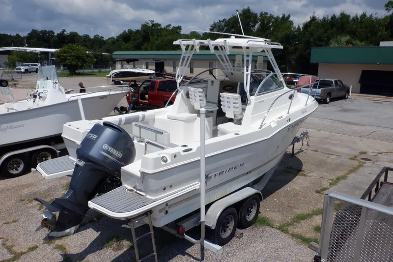 Slide: The Image of 2015 Seaswirl Striper 220 Walkaround boat on trailer with Yamaha outboard motor. - 5