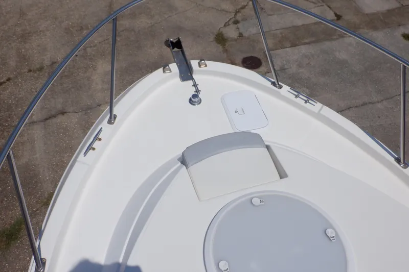 Slide: The Image of 2015 Seaswirl Striper 220 Walkaround boat deck with railing and hatch. - 6