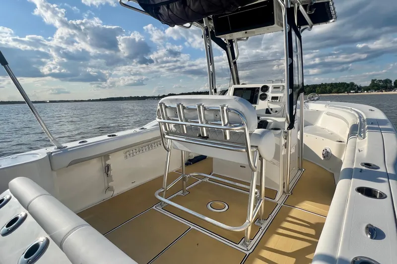 Slide: The Image of 2011 Key West 244 Center Console boat on calm water under a partly cloudy sky. - 14
