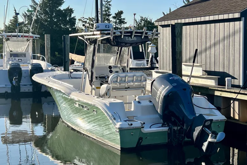 Slide: The Image of 2011 Key West 244 Center Console boat docked with Yamaha outboard motor. - 3