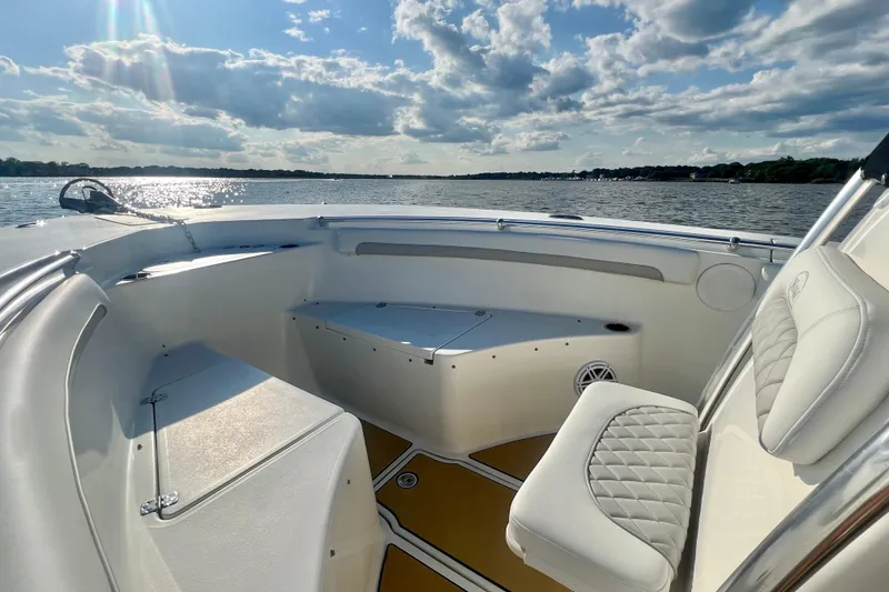 Slide: The Image of 2011 Key West 244 Center Console boat interior on a sunny day, overlooking calm waters. - 7