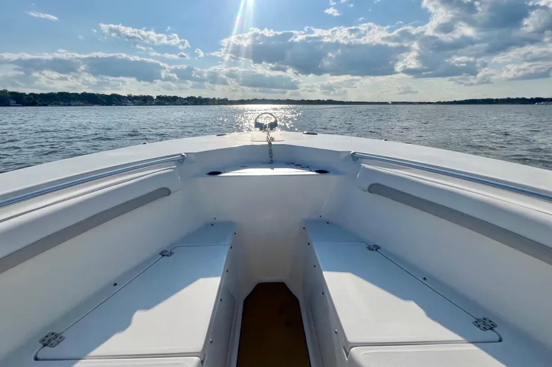 Slide: The Image of 2011 Key West 244 Center Console boat on a sunny day, open water view. - 9