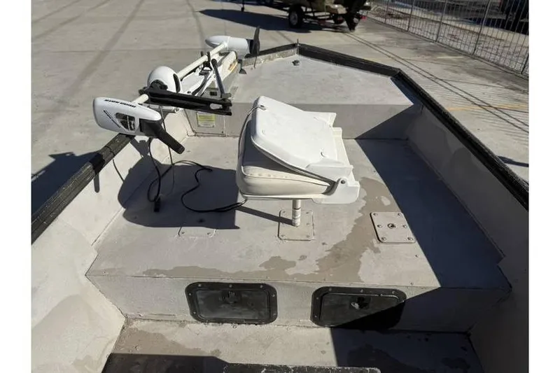 Slide: The Image of 2000 War Eagle 18ft CC boat deck with seat and trolling motor. - 11