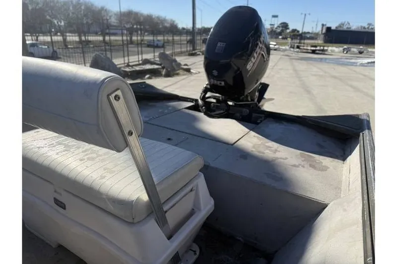 Slide: The Image of 2000 War Eagle 18ft CC boat with Suzuki outboard motor and white seating. - 9