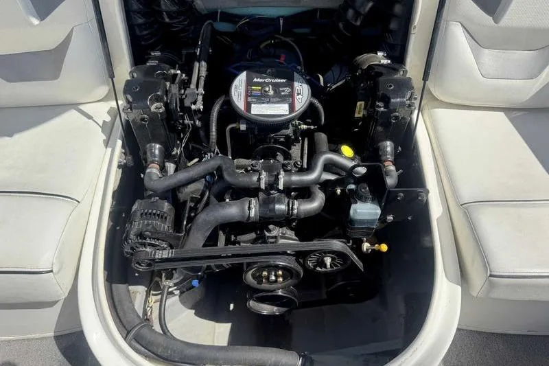 Slide: The Image of 2008 Bayliner Element F18 boat on trailer in parking lot, blue and white design. - 5