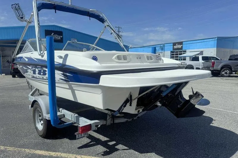 Slide: The Image of 2008 Bayliner Element F18 boat interior with steering wheel and dashboard controls. - 6