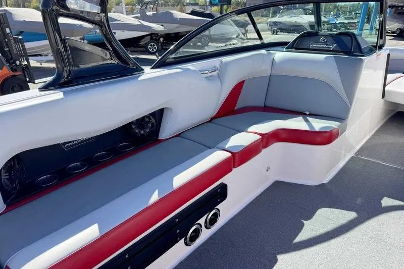 Slide: The Image of 2016 Moomba Mojo boat interior with red and gray seating, modern design. - 14