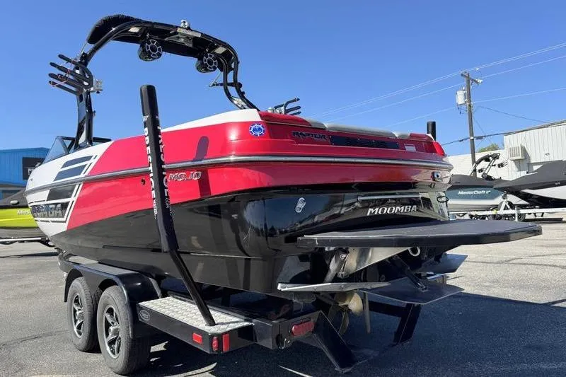 Slide: The Image of 2016 Moomba Mojo boat on trailer in parking lot, side view. - 3