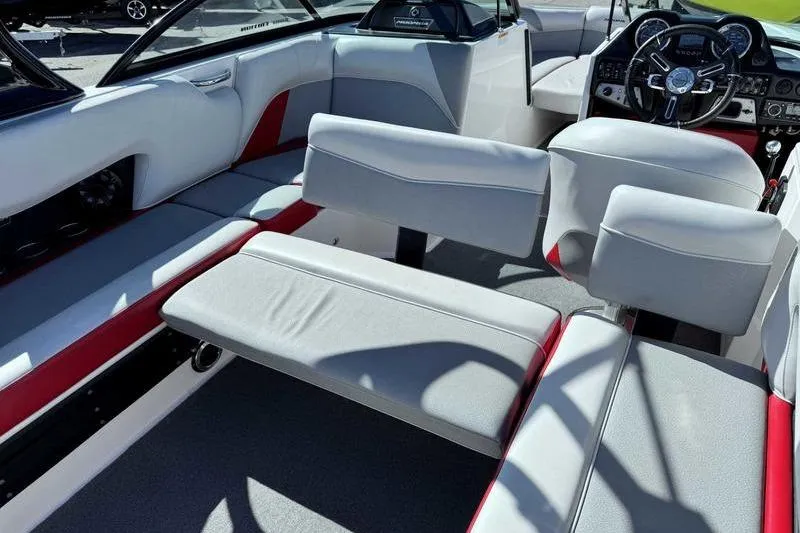 Slide: The Image of 2016 Moomba Mojo boat rear view with Raptor engine, parked on trailer. - 5