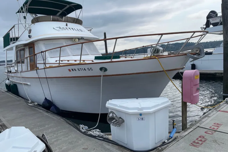 Slide: The Image of 1981 Cheer Men Marine PT 38 Europa yacht docked at marina, overcast sky. - 1