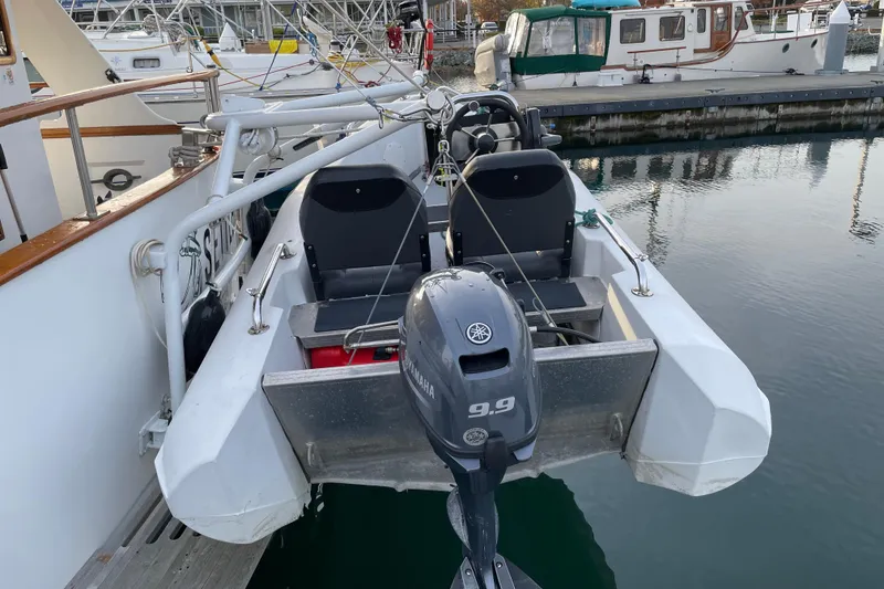 Slide: The Image of 1981 Cheer Men PT 38 Europa boat with Yamaha 9.9 motor docked at marina. - 11