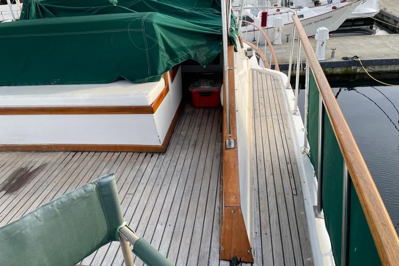 Slide: The Image of 1981 Cheer Men PT 38 Europa yacht deck with green covers and wooden railings. - 18