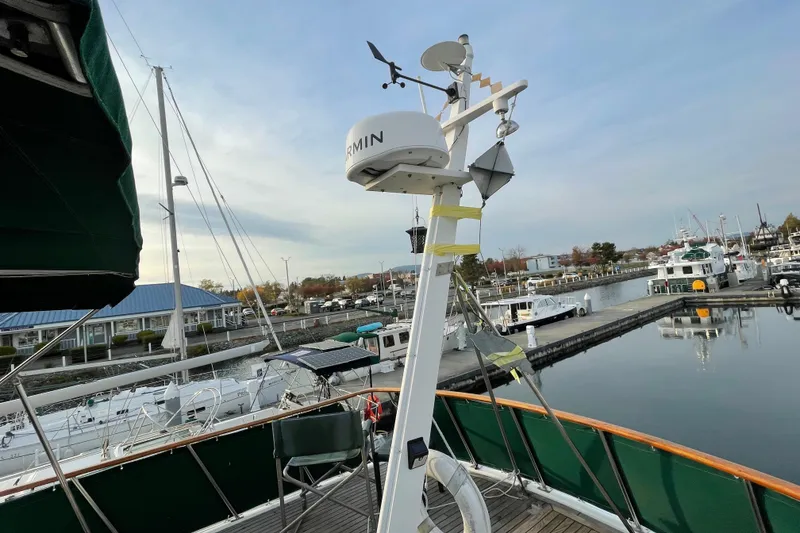 Slide: The Image of 1981 Cheer Men PT 38 Europa yacht docked at marina with navigation equipment. - 20