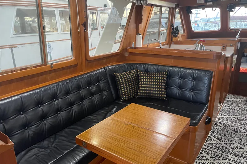 Slide: The Image of Luxurious 1981 Cheer Men PT 38 Europa yacht interior with leather seating and wooden accents. - 24