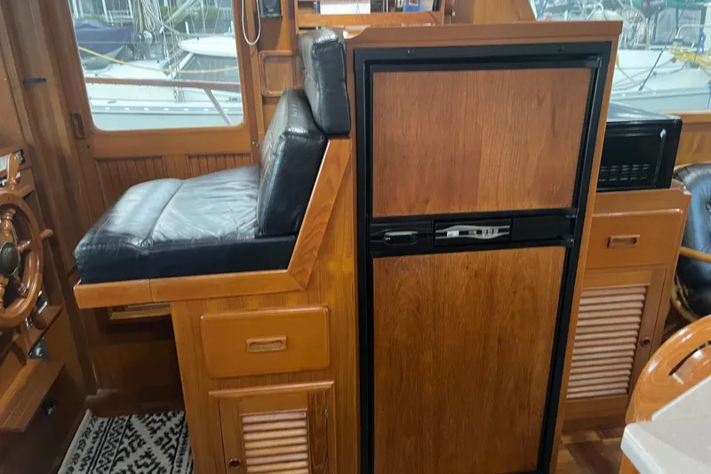 Slide: The Image of 1981 Cheer Men PT 38 Europa yacht interior with wooden cabinetry and leather seating. - 31