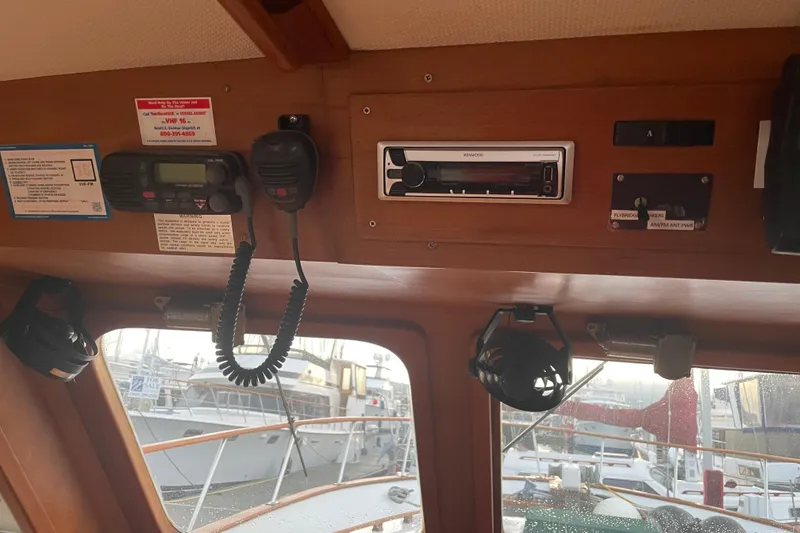 Slide: The Image of Interior of 1981 Cheer Men PT 38 Europa boat with radio and control panel. - 36