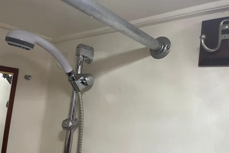 Slide: The Image of Shower area in 1981 Cheer Men PT 38 Europa boat, featuring chrome fixtures. - 48