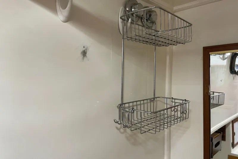 Slide: The Image of Wall-mounted metal basket shelves in a 1981 Cheer Men PT 38 Europa interior. - 49