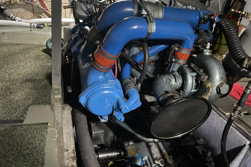 Slide: The Image of Engine compartment of 1981 Cheer Men PT 38 Europa with blue pipes and mechanical components. - 53