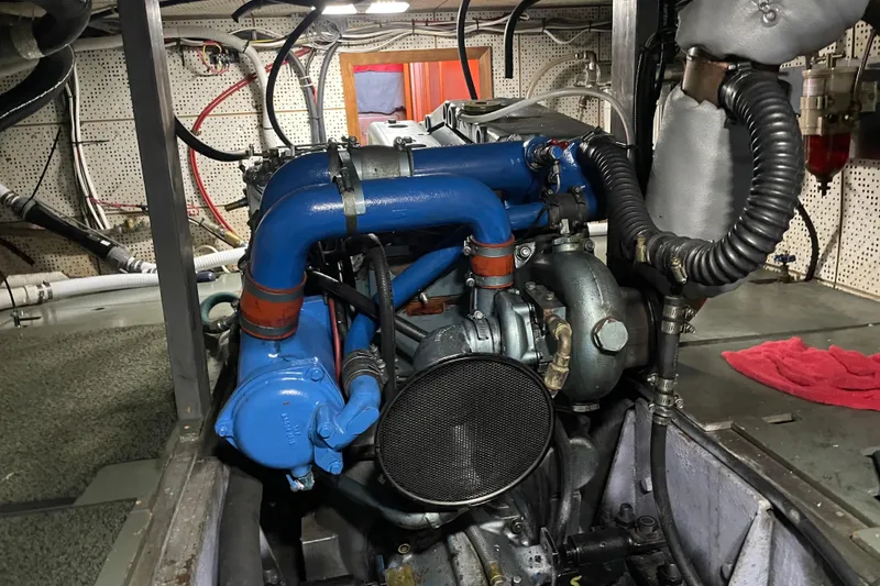 Slide: The Image of Engine room of 1981 Cheer Men PT 38 Europa with visible blue piping and components. - 54