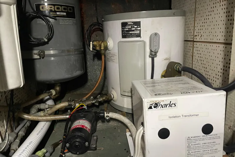 Slide: The Image of Electrical and plumbing setup in a 1981 Cheer Men PT 38 Europa boat. - 55